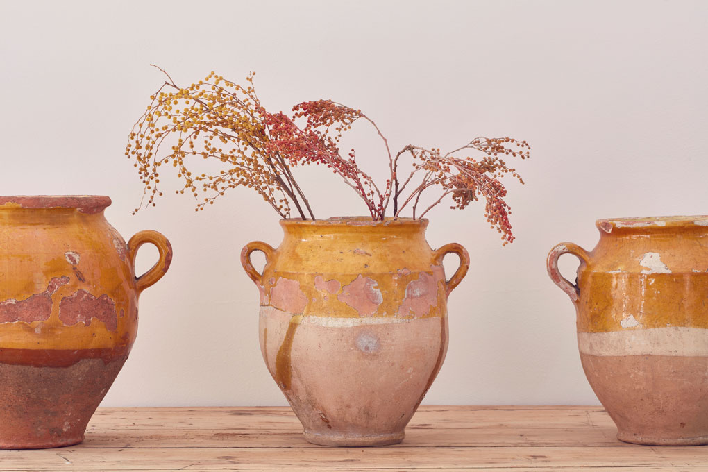 Antique French confit pot from Home Barn containing dried flowers