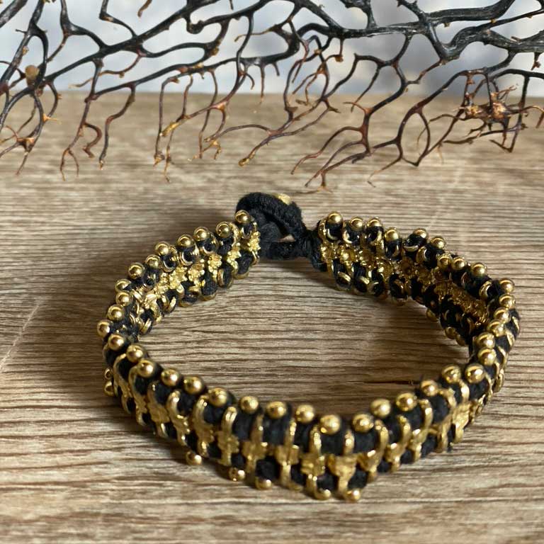 Ethnic woven bracelet black | gold