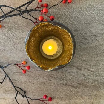 Zinc candle holder with gold interior