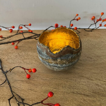 Zinc candle holder with gold interior