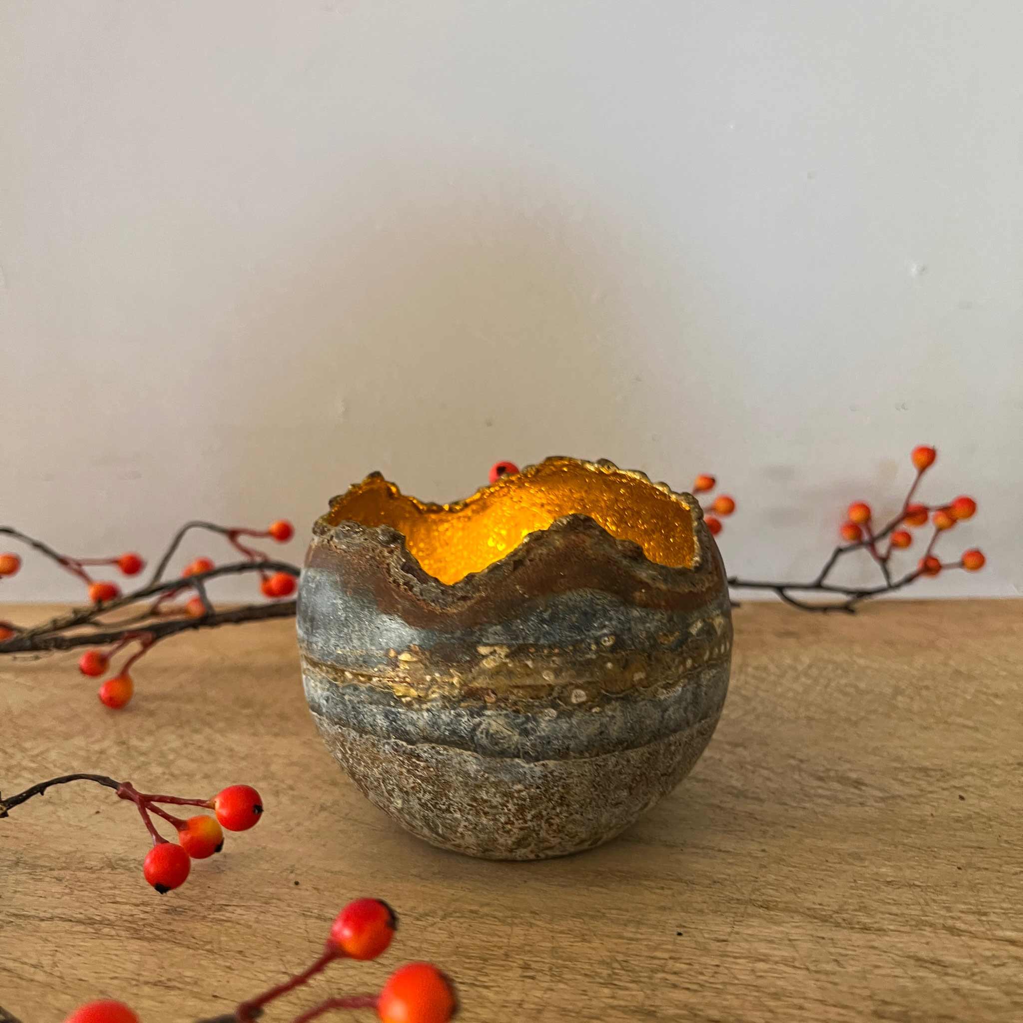 Zinc candle holder with gold interior