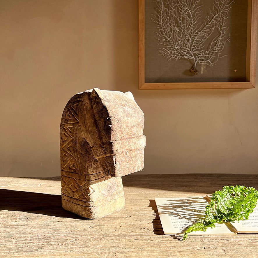 Hand carved stone horse head