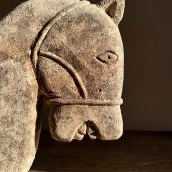 Hand carved stone primitive horse