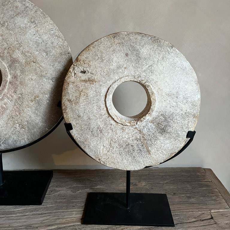 This stunning Antique Mill Stone Disc | Small, mounted on a stylish metal stand to up-cycle this original Rustic Millstone into beautiful home accessory.
