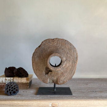 Wooden sculpture on stand