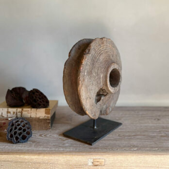 Wooden sculpture on stand