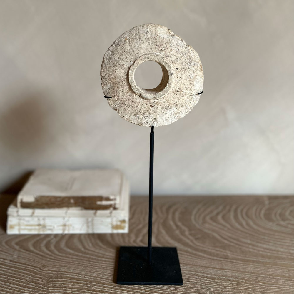 Antique stone disc on stand | C