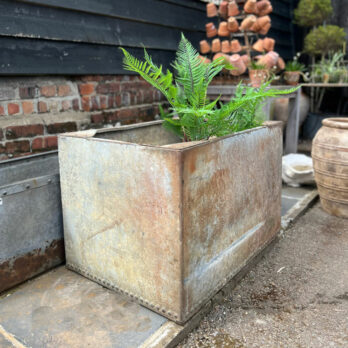 Vintage water tank planter