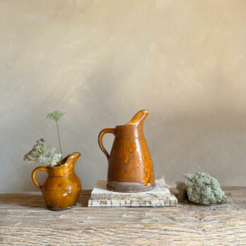 Pair antique glazed cider jugs