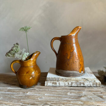 Pair antique glazed cider jugs