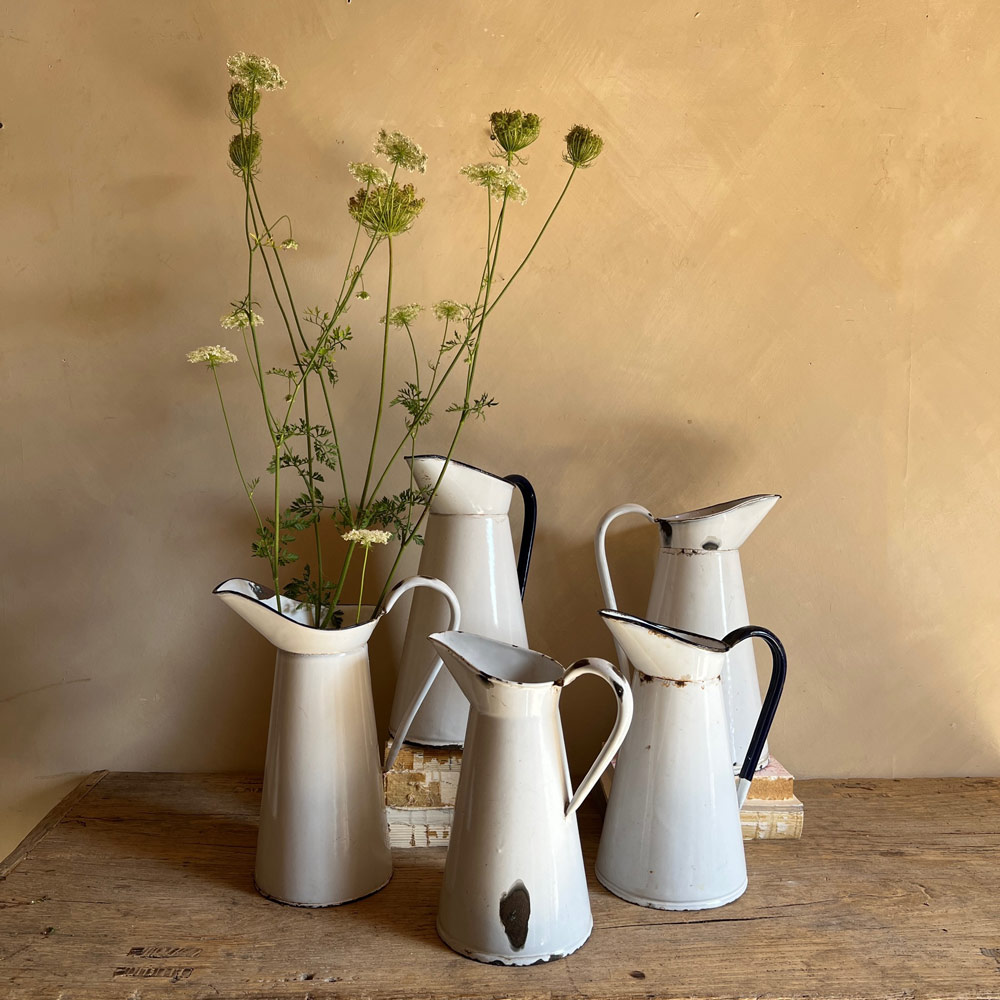 Antique enamelled white jug