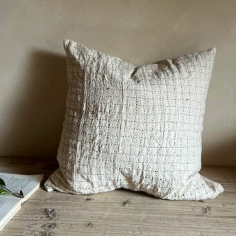 Black handstitched patchwork cushion