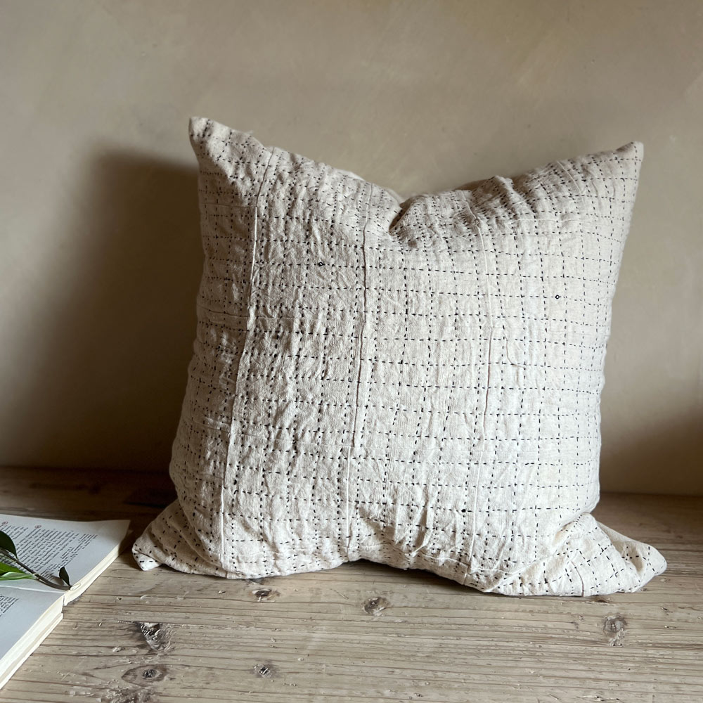 Black handstitched patchwork cushion